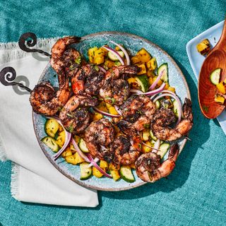 Jerk Shrimp With Pineapple Salad on blue fabric